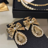 18K CC 25K Golden Bow Earrings